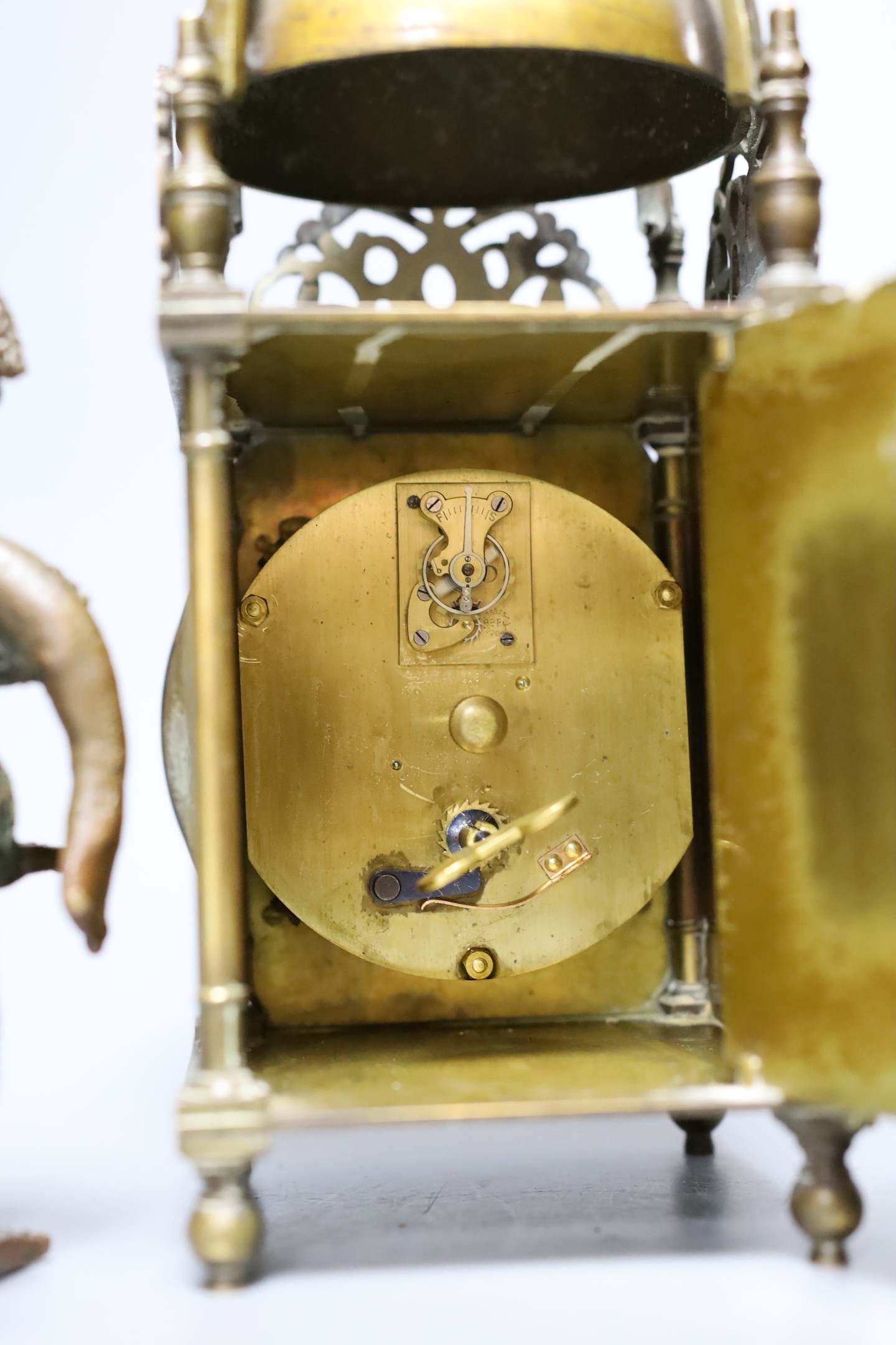 A cabochon-set pail, a 20th century lantern clock and an African cast metal figure